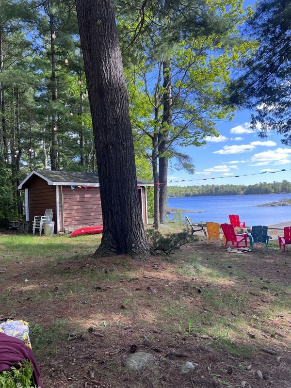 Waterfront yard with Muskoka chairs